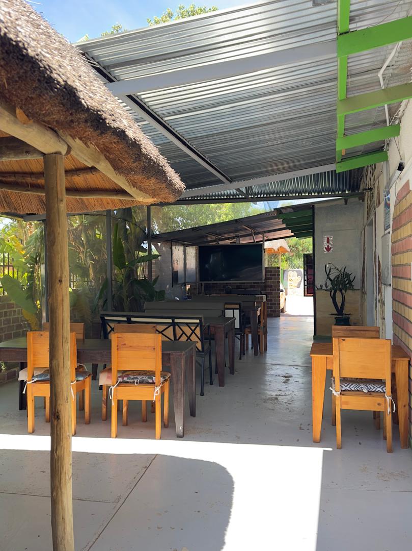 Outdoor thatched dining area at Tse Yaa Kuku restaurant